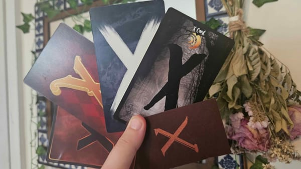 A photo showing five X-Cards from various games. 