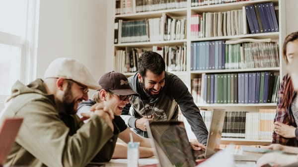 A photo of some students, presumably enjoying a TTRPG. Not D&D though.